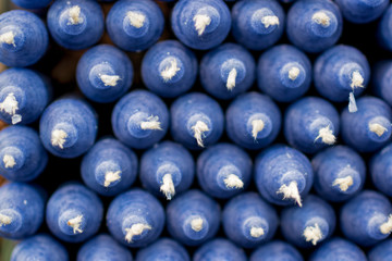 stack of brightly colored blue candles