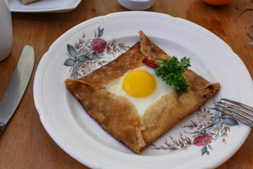 Galette sarrasin, buckwheat crepe, with ham cheese and egg, french brittany cuisine