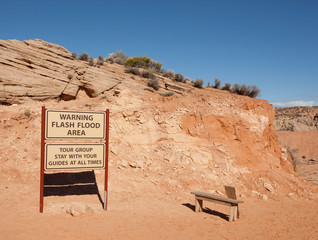 a sign warning all tourists to stay with their guides when touring the slot antelope canyons in arizona © nickjene