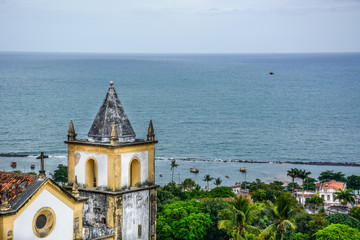 The architecture of the historic city of Olinda in Pernambuco, Brazil showcasing the Se Church dated from the 17th century in Baroque style at sunset.