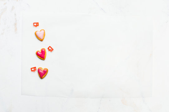 Heart Shape Cookies For Valentines Day And LIKE Symbols On Marble Background