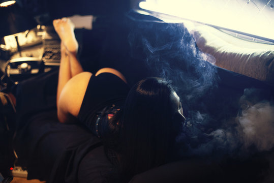 vapor concept,sexy woman in lingerie vaping Electronic hookah