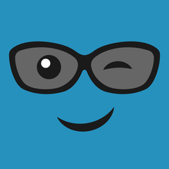 Emoticon smile with winking face with glasses