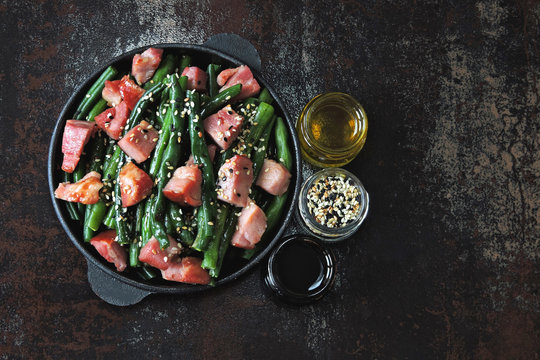 Green beans with bacon in a cast iron skillet. Keto diet.