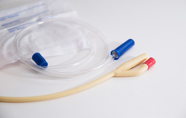 catheter with urinal bag are on a white background, dropper - obrazy, fototapety, plakaty