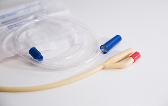 catheter with urinal bag are on a white background, dropper