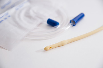 catheter with urinal bag are on a white background, dropper