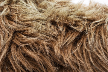 Close-up of a brown fake fur. Selective focus.