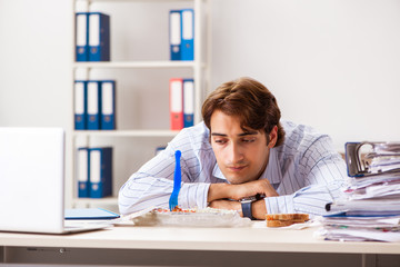 Man having meal at work during break