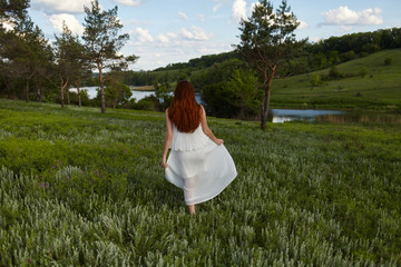  girl in a dress in nature