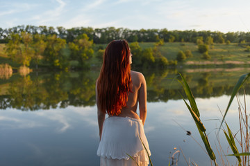  girl in a dress in nature
