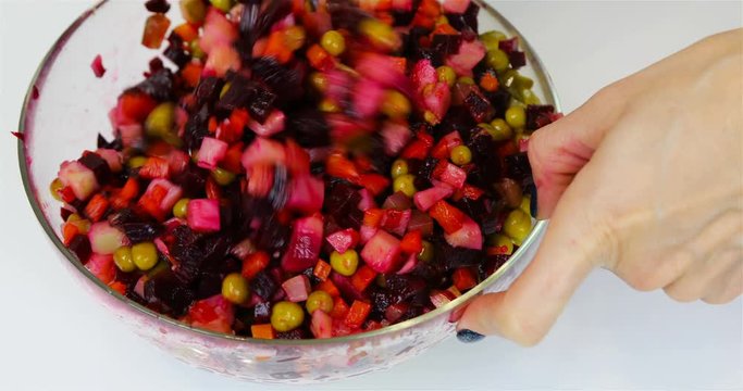 all ingredients of salad are mixed thoroughly with a tablespoon.