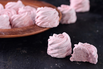 Spicy dessert with red pepper. Marshmallow Delicious and appetizing marshmallow with taste of red pepper on a black background.