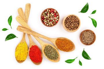 mix of spices in wooden spoon isolated on a white background. Top view. Flat lay. Set or collection