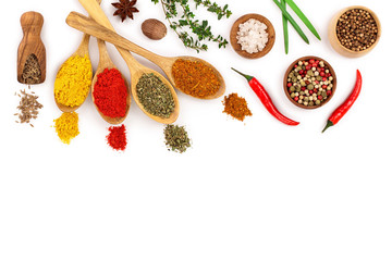 mix of spices in wooden spoon isolated on a white background with copy space for your text. Top view. Flat lay. Set or collection