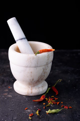 Pepper bitter red pepper. Seasoning. Spice. Red dried peppers on a black table.