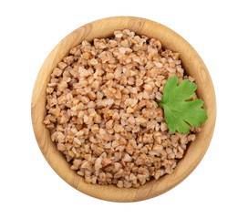 Buckwheat porridge in wooden bowl isolated on white background. Top view