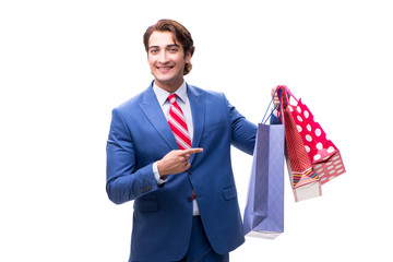 Elegant businessman with bags isolated on white