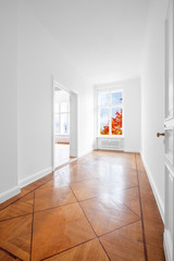 empty room with historic parquet floor newly renovated old building  - -