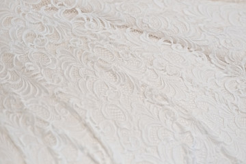 Wedding lace dress background. Fabric texture.
