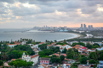 Aerial view of the historic city of Olinda in Pernambuco, Brazil at sunset contrasting with the...