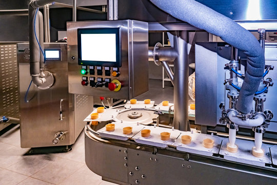 Ice cream making. Shop for the production of ice cream. Food industry. Dispenser. Food production line. Conveyor.  Dispenser  with remote control.