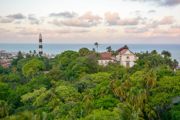 Fototapeta na wymiar Aerial view of Olinda Lighthouse and Church of Our Lady of Grace, Catholic Church built in 1551, surounded by palms, Olinda, Pernambuco, Brazil
