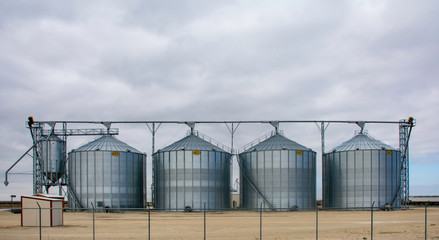 Grain silos on the side of the road © Brian