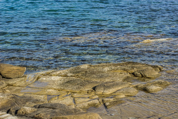 local scenic landscape of stone near rocky shoreline coast of tropic south sea wallpaper background concept photography with empty copy space for your text or inscription 