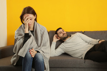 Young couple having problems in a relationship. Feeling stressed, angry and unhappy in the relationship