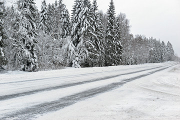 Road covered in ice and snow in Finland - 245820898