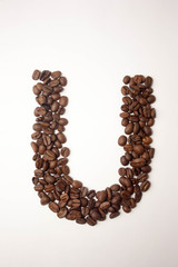 u letter. alphabet of coffee. coffee beans. concept