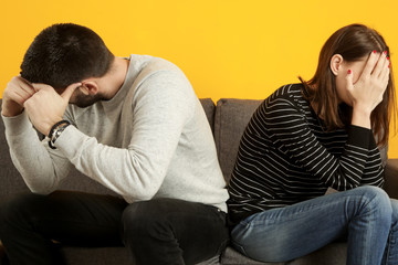 Young couple having problems, feeling stressed, angry and unhappy in the relationship