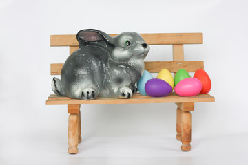 Easter. Easter bunny on a bench