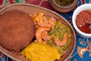 Brazilian food: acaraje on the plate with typical fillings