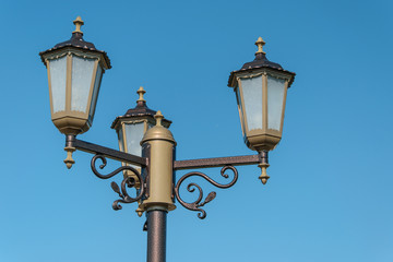 Fototapeta na wymiar Street lamp on the sky background.