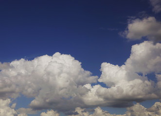 Naklejka na ściany i meble white fluffy clouds in the blue sky 