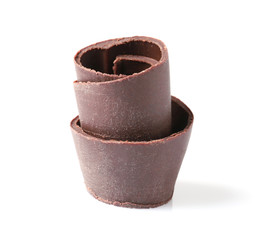 Yummy chocolate curl for decor on white background