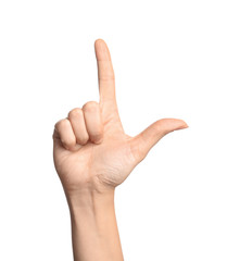 Woman showing L letter on white background, closeup. Sign language