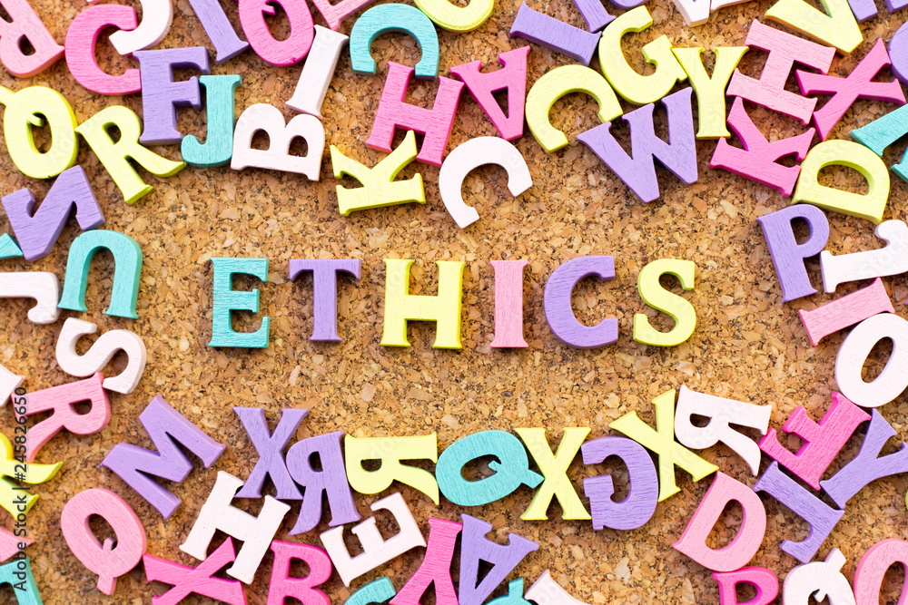 Sticker Color alphabet in word ethics with another letter as frame on cork board background