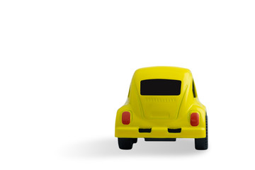 small yellow metal car isolated on white background