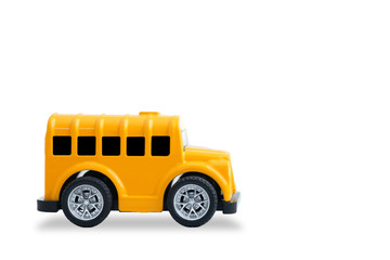 small yellow metal toy school bus isolated on white background