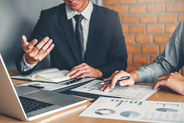 Co-working Business Team meeting Planning Strategy Analysis investment and saving concept. meeting discussing new plan financial graph data on Laptop.