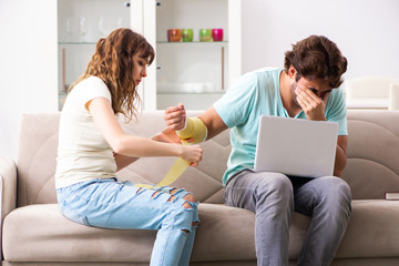 Young family helping each other after injury