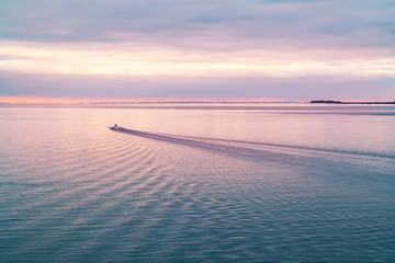 Patrol boat in the Finnish Gulf at sunset