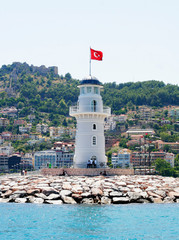 Fototapeta na wymiar Alanya lighthouse near sea