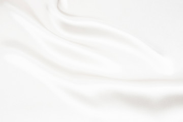 Obraz premium The texture of the satin fabric of white color for the background