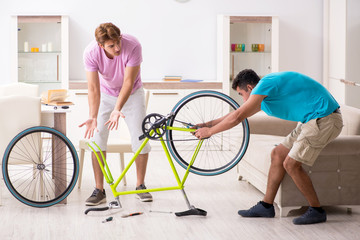 Man repairing his broken bicycle