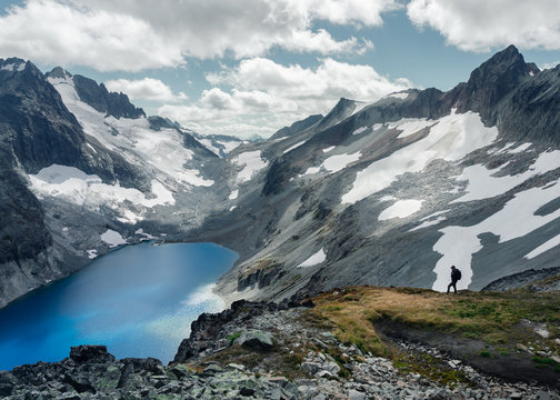 Scenic view of mountains with lake against cloudy sky in North Cascades National Park