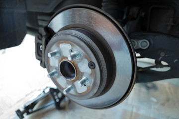 Disc brake rotor and pads on a vehicle